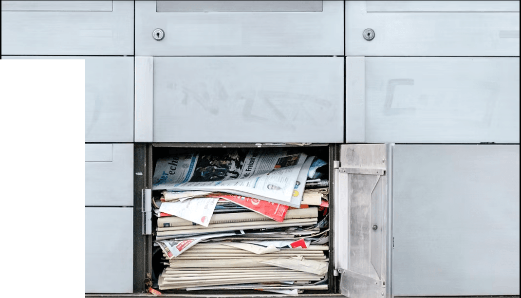 Mailbox stuffed with newsletters